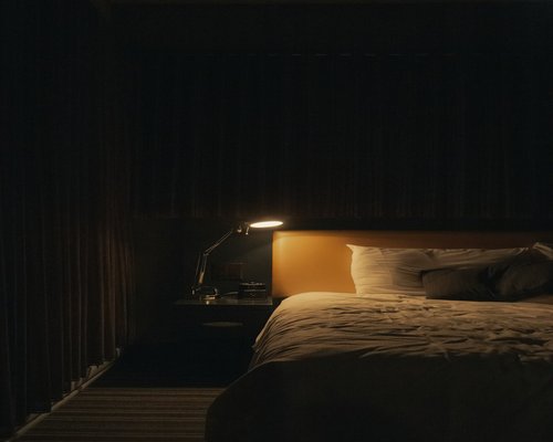 Peaceful dark bedroom setup for good sleep